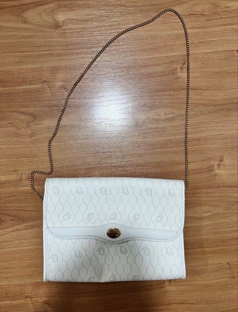 Christian Dior White Crossbody Bag (Category: Luxury Bags & Wallets) located in Manila. Submitted by leanne.closet (Listing ID 1433252109, Image 1). Description: Vintage Christian Dior bag owned by my grandmother. This was bought from USA in the 1990s. The external leather material is still in very good condition, no signs of cracks. The interior has some leather cracks (pls see pics for reference). Aside from the interior leather cracks, no othe