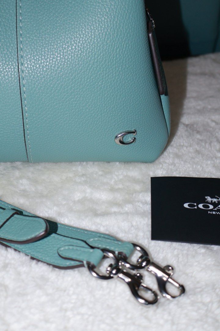 Coach Lana 23 Aquamarine (Category: Luxury Bags & Wallets) located in Paranaque City. Submitted by qwerein (Listing ID 1433216616, Image 3). Description: Coach Lana 23 Aquamarine Rare color/Seasonal 🩵 - Stunning teal color - Matching strap included - Top handle and detachable strap for crossbody wear - Includes Coach tag and care card - Silver-tone Coach logo No issues at all can pass at brandnew! Rfs: decluttering Bought in US! Can show receipt