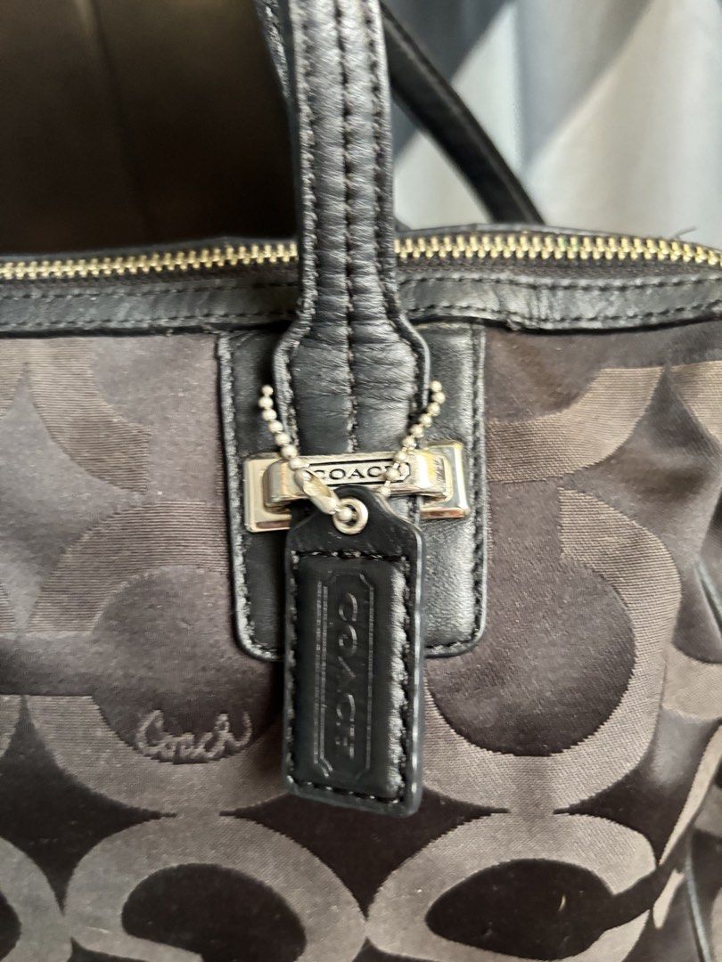 Coach Signature Satchel Handbag (Category: Luxury Bags & Wallets) located in Manila. Submitted by nigel_ky (Listing ID 1433304992, Image 3). Description: - Authentic Coach satchel handbag - Black and grey signature pattern - Detachable shoulder strap - Top handles - Coach interior label with serial number - Silver-tone hardware - Zipper closure - Exterior shows some wear loc : malate, manila mop : gcash mod : lalamove + manage your expectations :