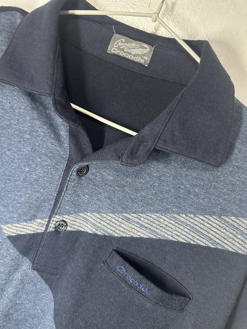 Crocodile Long Sleeve Polo Shirt (Category: Tshirts & Polo Shirts ) located in Batangas. Submitted by jim2621 (Listing ID 1433228826, Image 2). Description: - Long-sleeved polo shirt - Unique geometric blue design - Classic polo collar - Chest pocket with Crocodile logo - Crocodile logo buttons - Ribbed cuffs - Comfortable fabric.