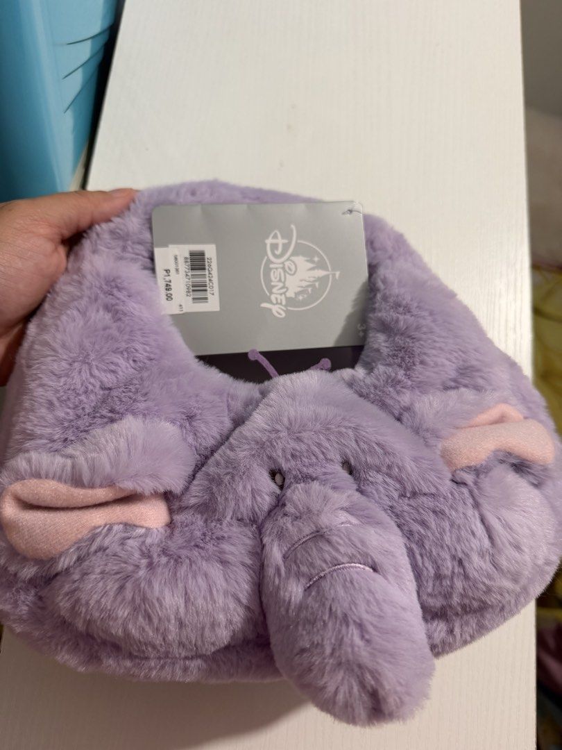 Disney Dumbo Plush Handbag (Small) (Category: Babies & Kids Fashion) located in Mandaluyong City. Submitted by bufifinds (Listing ID 1433234523, Image 3). Description: - Dumbo-themed handbag - Soft, plush lavender material - Features Dumbo's face design - Includes Disney tag - orig Price: ₱1,749.00 - Ideal for Disney enthusiasts.