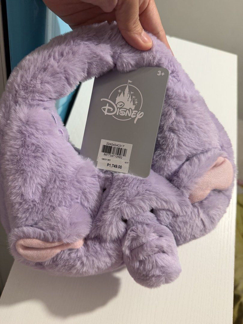 Disney Dumbo Plush Handbag (Small) (Category: Babies & Kids Fashion) located in Mandaluyong City. Submitted by bufifinds (Listing ID 1433234523, Image 1). Description: - Dumbo-themed handbag - Soft, plush lavender material - Features Dumbo's face design - Includes Disney tag - orig Price: ₱1,749.00 - Ideal for Disney enthusiasts.
