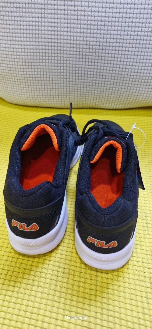 Fila Shoes for Men (Category: Sneakers) located in Paranaque City. Submitted by nieshaprelovedshop (Listing ID 1433386322, Image 3). Description: - Fila running shoes - Color: Navy blue with white soles and orange accents - Size: US 10, EUR 43, UK 9, MEX 28 - Features: Mesh upper - Condition: New with tags.