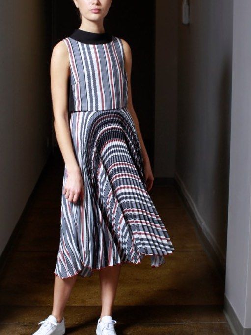 Formal Striped Pleated Dress (Category: Dresses) located in Caloocan City. Submitted by tiannnaaa (Listing ID 1433096771, Image 2). Description: - Sleeveless design - High neckline - Striped pattern (gray, white, red) - Pleated skirt - Midi length - Suitable for various occasions.
