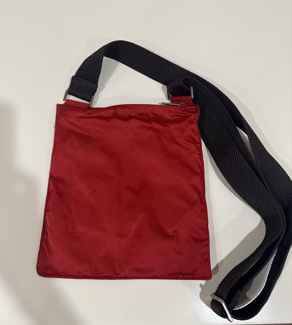 Furla Red Crossbody Bag (Category: Luxury Bags & Wallets) located in Manila. Submitted by caseller26 (Listing ID 1433325090, Image 2). Description: - Furla red crossbody bag - Black adjustable strap - Square shape - Features Furla logo - Made of nylon-like material.