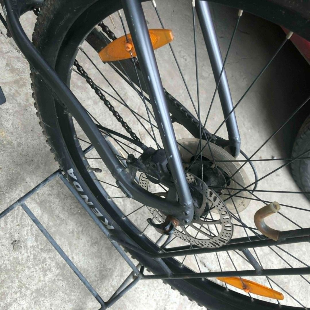Giant Talon 29er Mountain Bike (Category: Bicycles) located in Los Banos. Submitted by drjcpascual (Listing ID 1419822321, Image 3). Description: Giant Talon 29er mountain bike features a gray frame with orange accents. It has Kenda Booster tires and a black seat. It includes front suspension and a water bottle cage. Bought in 2022 - Original price: ₱25,000 (exact amount not recalled) - Condition: Has some dents (does not affect performance) - RF