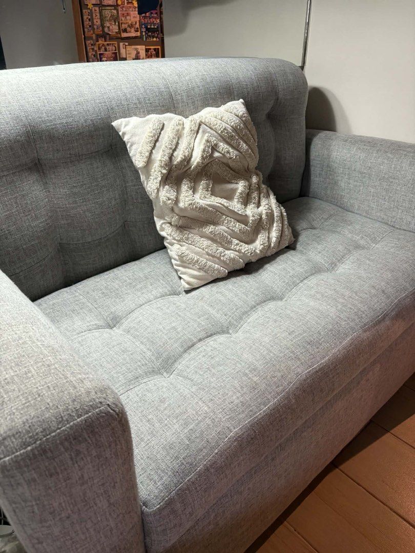 Gray 2-Seater Sofa with Storage (Category: Sofas) located in Makati City. Submitted by jamfab11 (Listing ID 1433306410, Image 3). Description: H 34 inches L 50 inches W 27 inches Stylish gray 2-seater sofa - Tufted back and seat cushions - Comfortable armrests - Sturdy wooden legs - Hidden storage compartment under the seat - Pillow not included - Perfect for small apartments or living rooms.