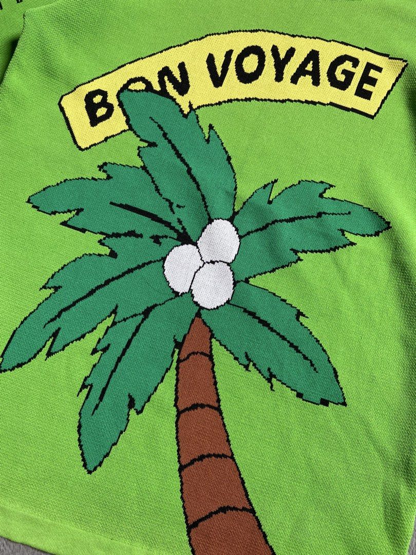 Green Palm Tree Graphic T-shirt (Category: Tshirts & Polo Shirts ) located in Antipolo. Submitted by casmiro (Listing ID 1433318205, Image 2). Description: - Green t-shirt - Features a 'Bon Voyage' palm tree graphic - 'Aloha!' detail on the sleeve - Round neckline - Short sleeves - Made of knit fabric - Perfect for a tropical look!.