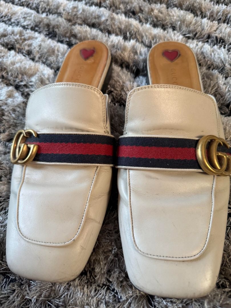 Gucci Princetown Leather Mules (Category: Sneakers & Footwear) located in Muntinlupa City. Submitted by clauisstuff (Listing ID 1433236987, Image 3). Description: 100% AUTHENTIC Gucci Princetown Leather Mules Heavily used (soles are worn out) Current Retail Price: PHP 58,000 - Off-white color - Size 40 - Iconic GG hardware - Red and navy stripe detail - Gucci logo on interior - Heart detail on insole RFS: Decluttering MOP: BDO/BPI/GotTyme only LO