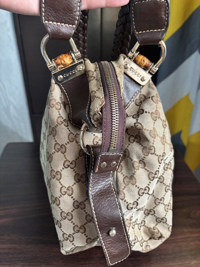 Gucci Vintage GG Canvas Handbag (Category: Luxury Bags & Wallets) located in Manila. Submitted by nigel_ky (Listing ID 1433304628, Image 3). Description: - Authentic Gucci handbag - Iconic GG canvas - Braided leather handles - Bamboo accents - Zipper closure - Classic and stylish loc : malate, manila mop : gcash mod : lalamove (sf paid by buyer) + manage expectations!.
