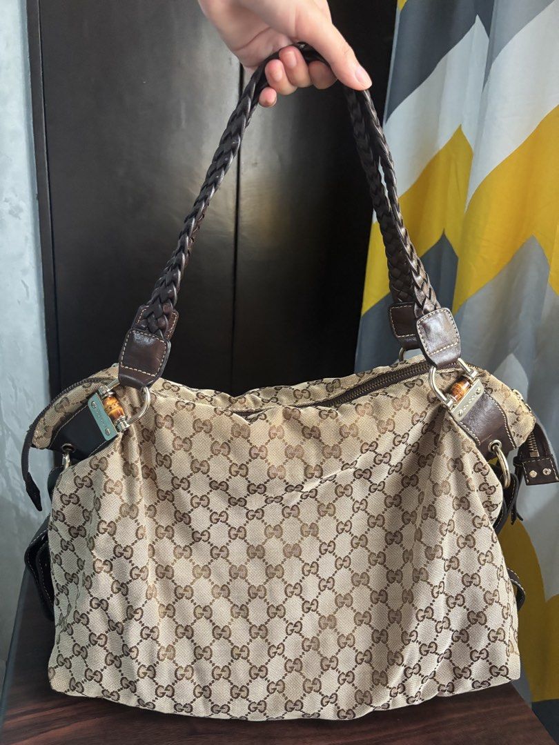 Gucci Vintage GG Canvas Handbag (Category: Luxury Bags & Wallets) located in Manila. Submitted by nigel_ky (Listing ID 1433304628, Image 1). Description: - Authentic Gucci handbag - Iconic GG canvas - Braided leather handles - Bamboo accents - Zipper closure - Classic and stylish loc : malate, manila mop : gcash mod : lalamove (sf paid by buyer) + manage expectations!.