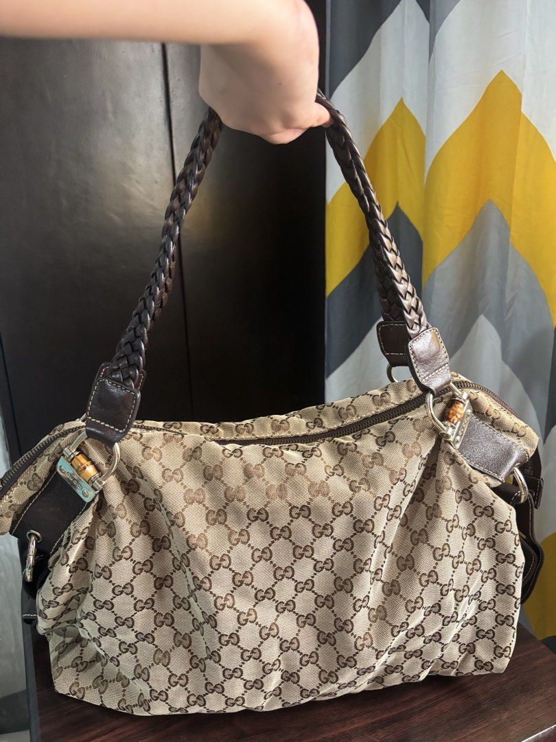 Gucci Vintage GG Canvas Handbag (Category: Luxury Bags & Wallets) located in Manila. Submitted by nigel_ky (Listing ID 1433304628, Image 2). Description: - Authentic Gucci handbag - Iconic GG canvas - Braided leather handles - Bamboo accents - Zipper closure - Classic and stylish loc : malate, manila mop : gcash mod : lalamove (sf paid by buyer) + manage expectations!.