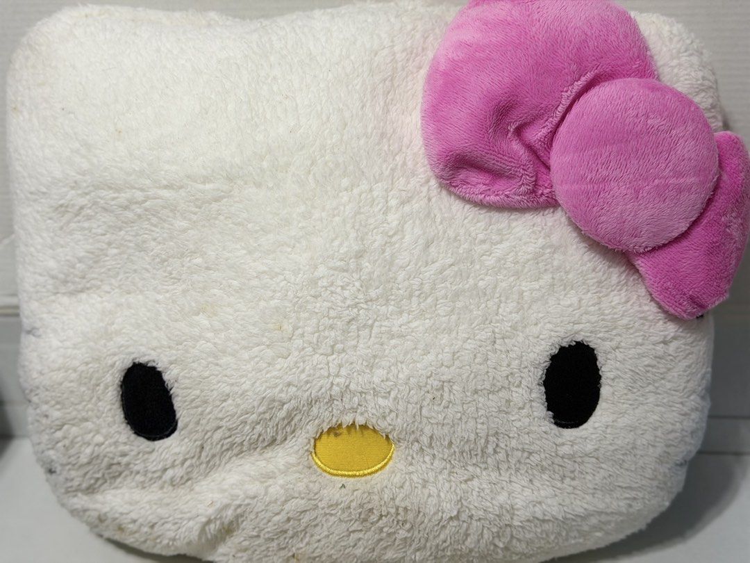 Hello Kitty Plush Pillow (Category: Plushies & Soft Toys) located in Makati City. Submitted by prelovedkitty13 (Listing ID 1433322376, Image 1). Description: - Super cute Kitty plush pillow! - Features a soft, white exterior. - Adorned with a sweet pink bow. - Classic black eyes and yellow nose. - Ideal for cuddling or as a decorative accent. - Perfect for Kitty enthusiasts!.