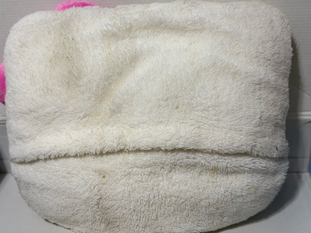 Hello Kitty Plush Pillow (Category: Plushies & Soft Toys) located in Makati City. Submitted by prelovedkitty13 (Listing ID 1433322376, Image 2). Description: - Super cute Kitty plush pillow! - Features a soft, white exterior. - Adorned with a sweet pink bow. - Classic black eyes and yellow nose. - Ideal for cuddling or as a decorative accent. - Perfect for Kitty enthusiasts!.