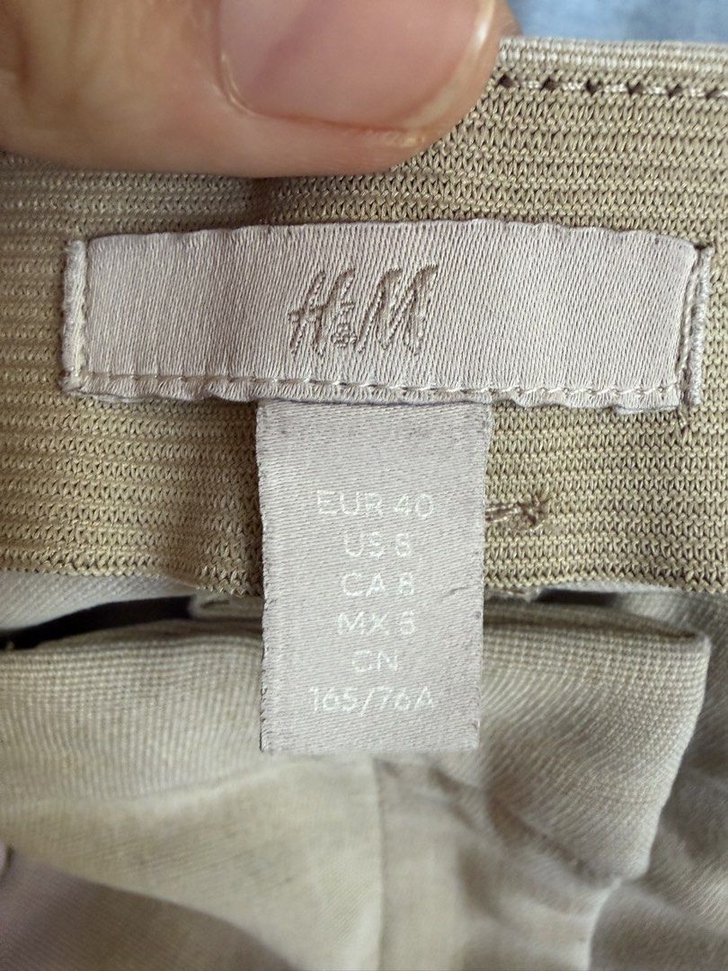 H&M Beige Trousers - EUR 40 (Category: Other Bottoms) located in Cebu City. Submitted by hellomolly_ (Listing ID 1433351483, Image 3). Description: - H&M beige trousers - Classic tailored fit - Size: EUR 40, US 6, CA 8, MX 5, CN 165/76A - Front zipper and pockets - Suitable for casual and formal wear - Comfortable, draping fabric - Office wear.