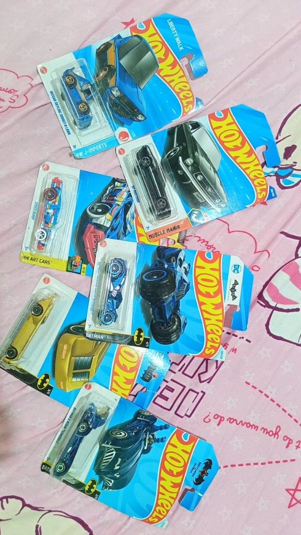 Hot Wheels Diecast Cars (Category: Vehicle & Diecast Models) located in Naga. Submitted by hitplus_ (Listing ID 1433226472, Image 1). Description: - Hot Wheels diecast car collection - Various models available - Cars in blue, black, and yellow colors - Some Batman-themed cars included - All cars are in their original packaging - Perfect for collectors and kids ASPACK NEGOTIABLE .