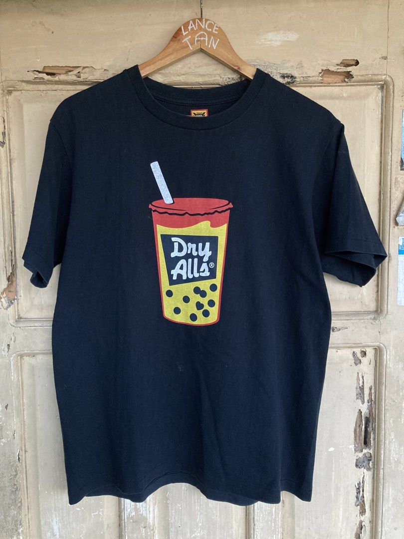 Human Made Dry Alls T-shirt (Category: Tshirts & Polo Shirts ) located in Panabo. Submitted by lancegoods69 (Listing ID 1433312050, Image 1). Description: Black Human Made Dry Alls tee. Features front graphic, yellow back logo, crew neck, and Human Made tag. Standard fit..