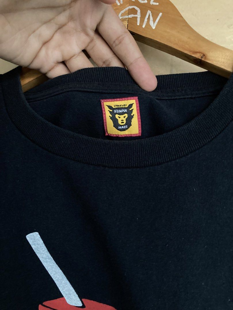 Human Made Dry Alls T-shirt (Category: Tshirts & Polo Shirts ) located in Panabo. Submitted by lancegoods69 (Listing ID 1433312050, Image 3). Description: Black Human Made Dry Alls tee. Features front graphic, yellow back logo, crew neck, and Human Made tag. Standard fit..
