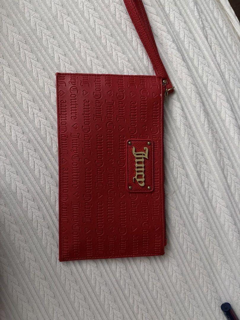 Juicy Couture Red Wristlet Wallet (Category: Wallets & Card holders) located in Taguig. Submitted by jac_declutters (Listing ID 1433266614, Image 1). Description: - Juicy Couture wristlet wallet - Vibrant red color - Signature logo and pattern - Zip closure - Wrist strap - Multiple compartments for cards and cash.