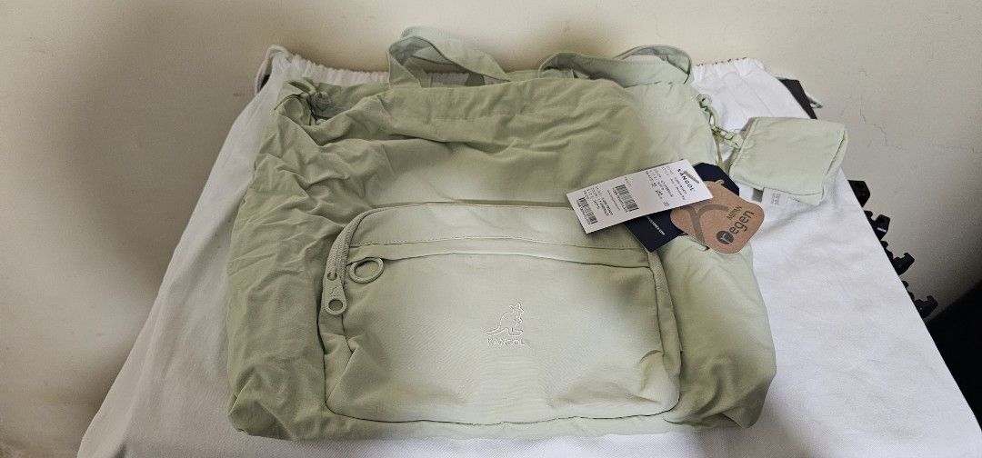 Kangol Jerry Tote Bag - Lt. Green (Category: Tote Bags) located in Cebu City. Submitted by dg_enterprise (Listing ID 1433349310, Image 1). Description: - Kangol Jerry Tote Bag in Lt. Green - Front zipper pocket - Includes a small matching pouch - Top handle and adjustable strap - Style: K088-TB39476 - Made with Mipan Regen fabric.