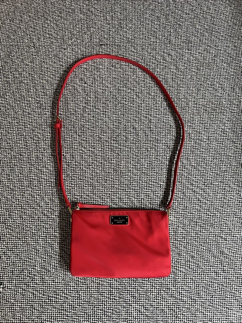 Kate Spade Red Crossbody Bag (Category: Cross-body Bags) located in Manila. Submitted by declutteringmomma_ida (Listing ID 1433253703, Image 1). Description: - Vibrant red Kate Spade crossbody bag - Adjustable long strap - Secure zippered main compartment - Multiple interior pockets for organization - Small Kate Spade logo on the front - Red interior lining with Kate Spade logo.