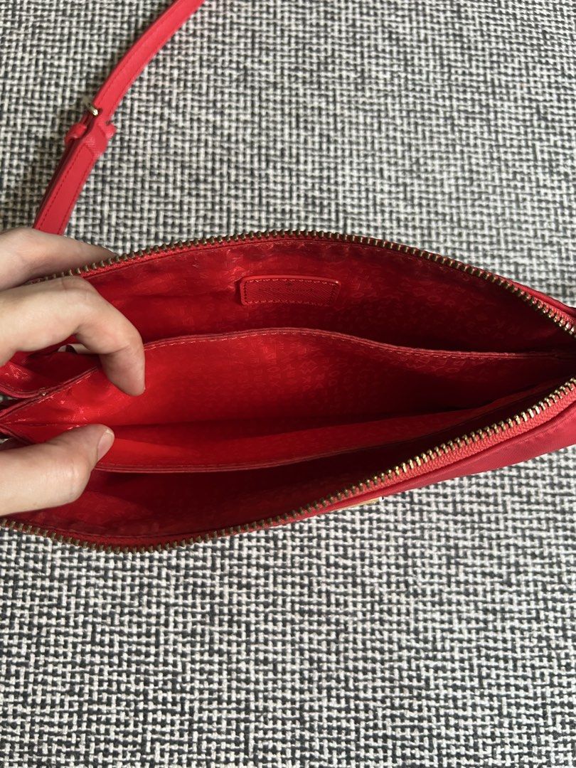 Kate Spade Red Crossbody Bag (Category: Cross-body Bags) located in Manila. Submitted by declutteringmomma_ida (Listing ID 1433253703, Image 2). Description: - Vibrant red Kate Spade crossbody bag - Adjustable long strap - Secure zippered main compartment - Multiple interior pockets for organization - Small Kate Spade logo on the front - Red interior lining with Kate Spade logo.