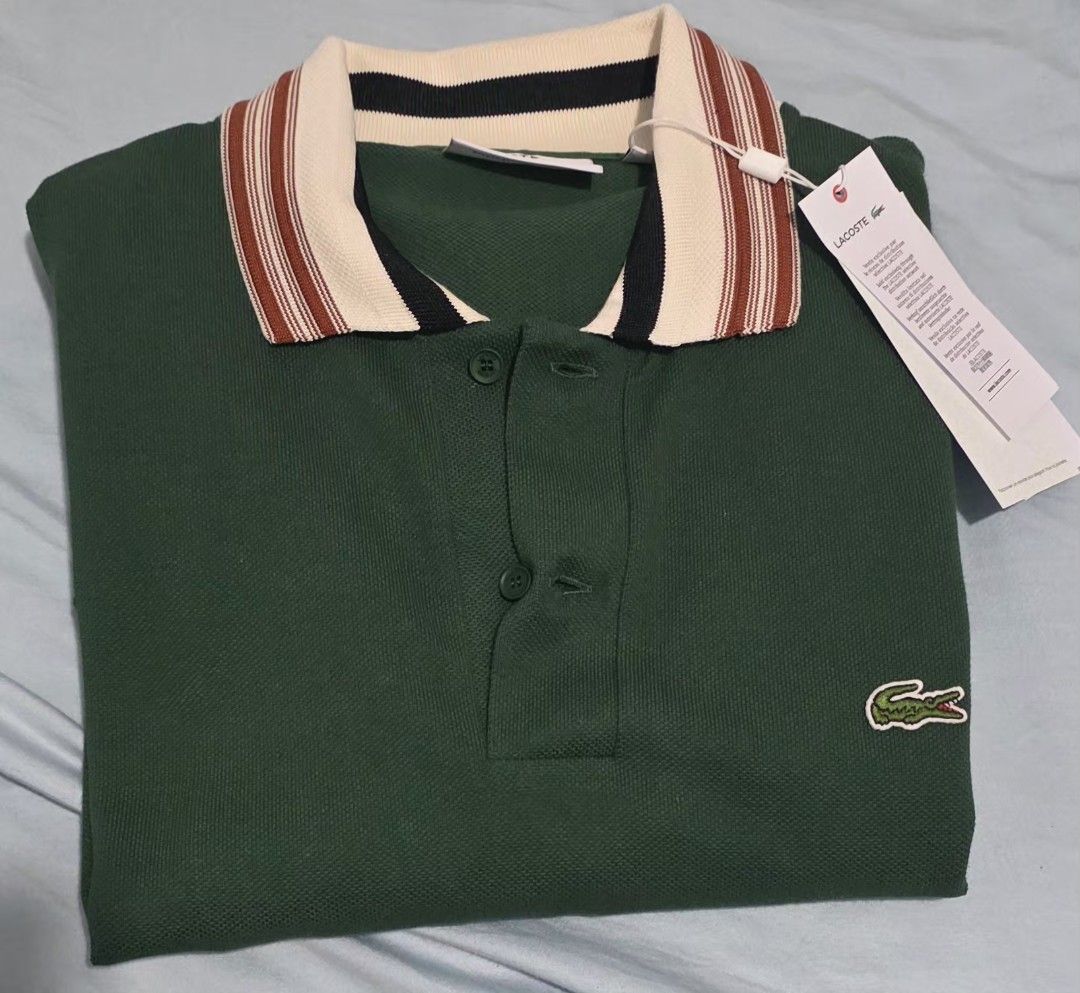 Lacoste Classic Fit Polo Shirt (Category: Tshirts & Polo Shirts ) located in Manila. Submitted by afernandez345 (Listing ID 1433224617, Image 1). Description: - Authentic Lacoste polo shirt - Classic fit - Green body - Striped collar (cream, red, black) - Iconic Lacoste crocodile logo - Made in France - Bought directly from FRANCE -Size: Fr-5 US-L - Comes with original tags.