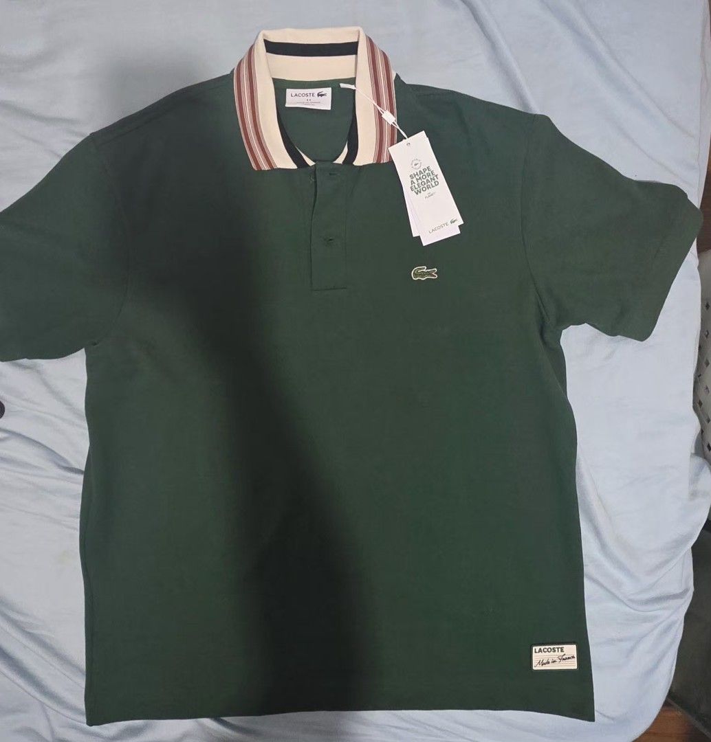 Lacoste Classic Fit Polo Shirt (Category: Tshirts & Polo Shirts ) located in Manila. Submitted by afernandez345 (Listing ID 1433224617, Image 2). Description: - Authentic Lacoste polo shirt - Classic fit - Green body - Striped collar (cream, red, black) - Iconic Lacoste crocodile logo - Made in France - Bought directly from FRANCE -Size: Fr-5 US-L - Comes with original tags.