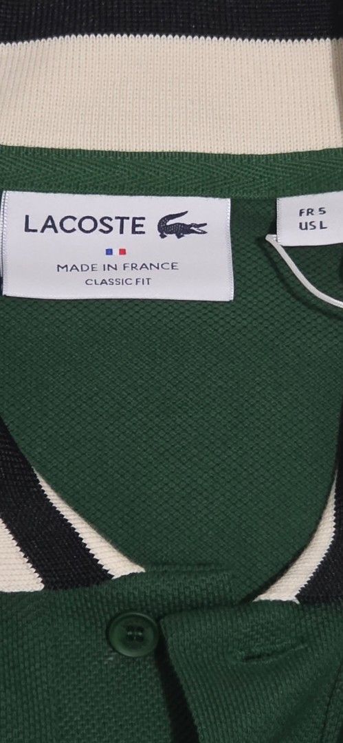 Lacoste Classic Fit Polo Shirt (Category: Tshirts & Polo Shirts ) located in Manila. Submitted by afernandez345 (Listing ID 1433224617, Image 3). Description: - Authentic Lacoste polo shirt - Classic fit - Green body - Striped collar (cream, red, black) - Iconic Lacoste crocodile logo - Made in France - Bought directly from FRANCE -Size: Fr-5 US-L - Comes with original tags.
