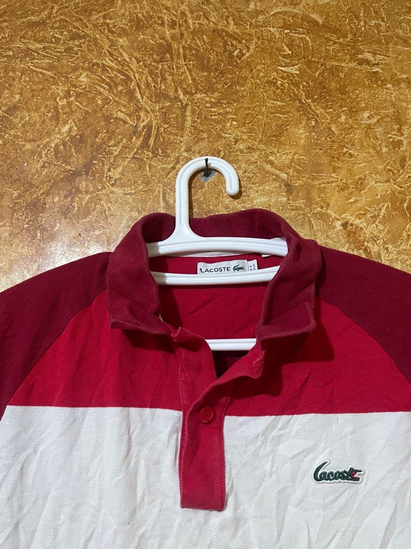 Lacoste Classic Fit Polo Shirt (Category: Tshirts & Polo Shirts ) located in Iligan City. Submitted by yolkfinds (Listing ID 1433355649, Image 2). Description: - Lacoste polo shirt - Size: M - Classic fit - Color block design (red, white, maroon) - Lacoste logo on chest - Made in Peru - Minor tear on the side 22 width 26 length 27 long back.
