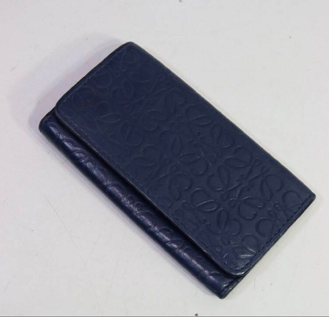 LOEWE Anagram 6 Key Holder Blue Leather (Category: Wallets & Card holders) located in Davao. Submitted by my_picks (Listing ID 1433335200, Image 1). Description: Authentic LOEWE 6 compartment key case in embossed Anagram leather Made in Spain Very good condition. Light signs of use such as minor creasing on leather, which is normal for this material. No major flaws, still structured and fully functional • Color: Deep blue • Material: Leather • 6 