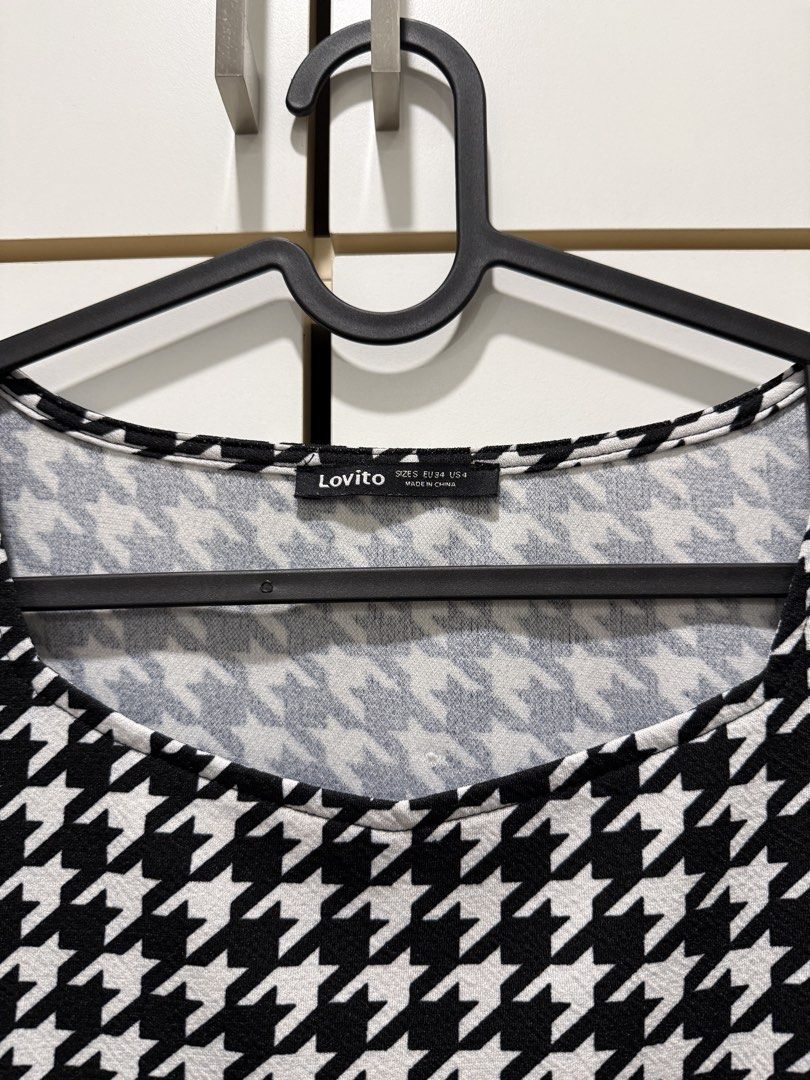 Lovito Top (Category: Blouses) located in Kuala Lumpur. Submitted by deannarasyid (Listing ID 1433359708, Image 2). Description: Lovito Top Size: S Features: - Classic houndstooth pattern - Short, puffed sleeves - Scoop neckline.