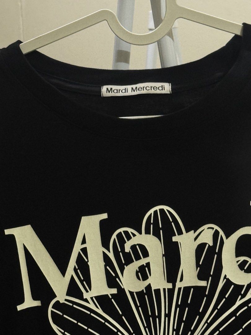 Mardi Mercredi Flower Tee - Black (Category: Shirts) located in Manila. Submitted by curateandcreate (Listing ID 1433390284, Image 3). Description: - Mardi Mercredi black t-shirt - Features a large daisy graphic - Brand name detail on neckline - Made of 100% cotton - One size - Manufactured in Korea, September 2024 Freesize - oversize fit 20-25 width.