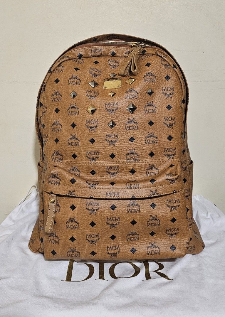 MCM Stark Backpack Cognac Visetos Large (Category: Luxury Bags & Wallets) located in Cebu City. Submitted by dg_enterprise (Listing ID 1433343397, Image 1). Description: - Authentic MCM Stark backpack - Cognac Visetos leather - Iconic MCM logo pattern - Includes Certificate of Authenticity - Spacious main compartment - Interior pocket - Exterior front pocket with zipper - Adjustable shoulder straps.
