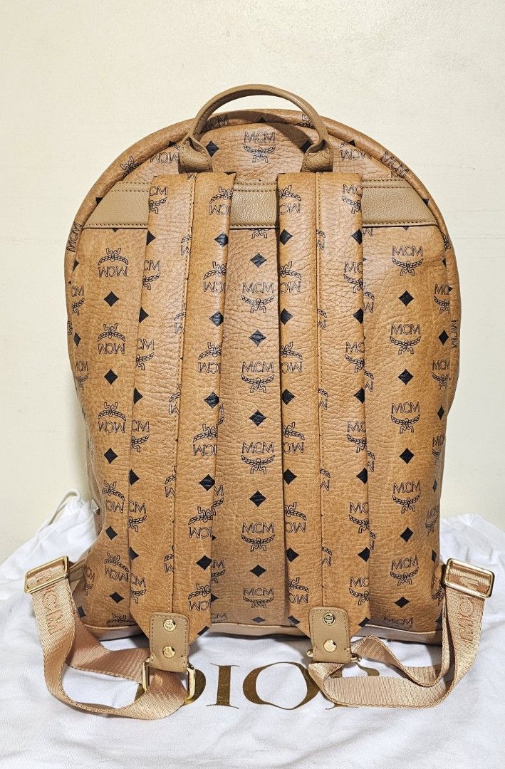MCM Stark Backpack Cognac Visetos Large (Category: Luxury Bags & Wallets) located in Cebu City. Submitted by dg_enterprise (Listing ID 1433343397, Image 2). Description: - Authentic MCM Stark backpack - Cognac Visetos leather - Iconic MCM logo pattern - Includes Certificate of Authenticity - Spacious main compartment - Interior pocket - Exterior front pocket with zipper - Adjustable shoulder straps.