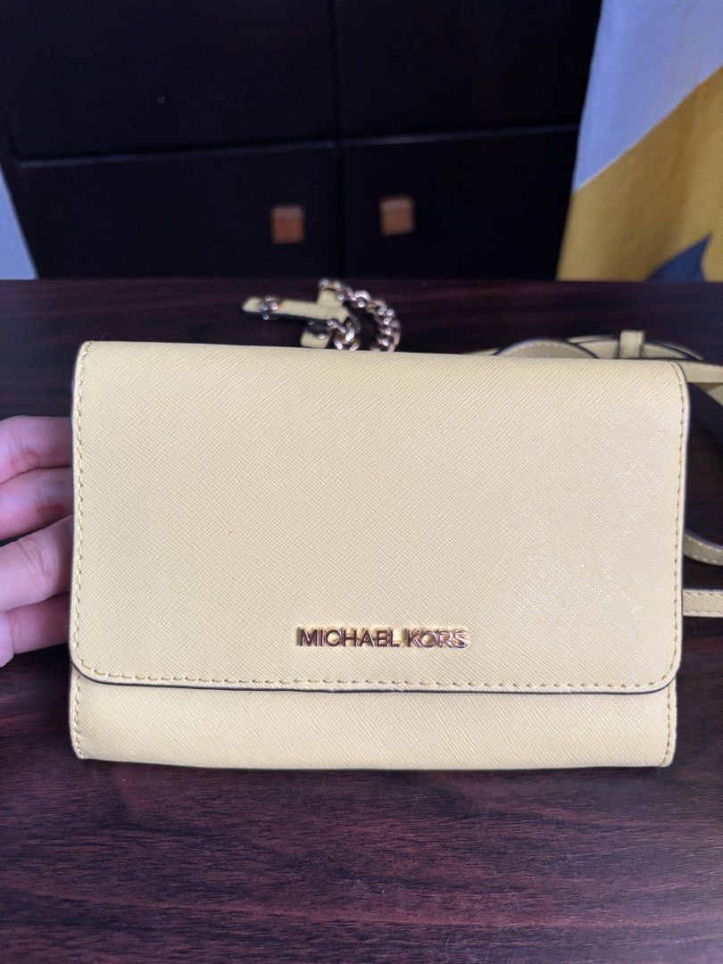 Michael Kors Yellow Crossbody Wallet (Category: Luxury Bags & Wallets) located in Manila. Submitted by nigel_ky (Listing ID 1433304902, Image 1). Description: - Michael Kors crossbody wallet - Vibrant yellow color - Detachable chain strap - Adjustable long strap - Multiple card and cash compartments - Snap closure - Gold-tone logo - Yellow interior loc : malate, manila mop : gcash mod : lalamove + manage your expectations :).