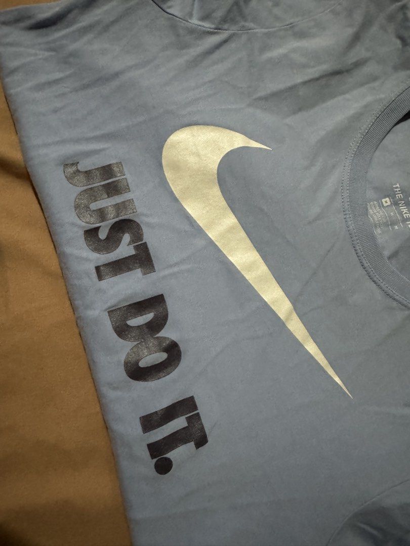 Nike Just Do It Tee - Medium (Category: Activewear) located in Dinalupihan. Submitted by declutteredbyaly (Listing ID 1433329533, Image 3). Description: - Nike "Just Do It" T-shirt - Light blue color - Features Nike swoosh logo - Size: Medium - Style: "The Nike Tee" - Runs small.