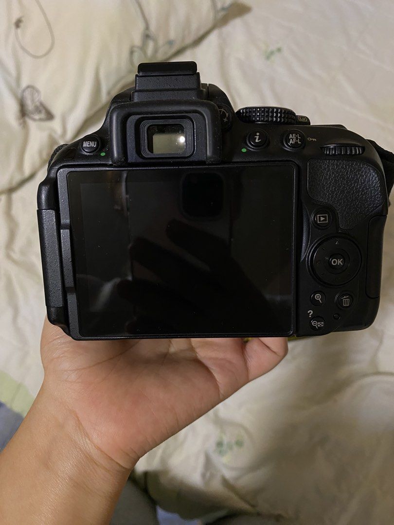 Nikon D5300 DSLR Camera with 18-55mm Lens (Category: Cameras) located in Cebu City. Submitted by soulineeee20 (Listing ID 1433355123, Image 3). Description: - Nikon D5300 DSLR camera - Includes 18-55mm lens (Nikon AF-P DX NIKKOR 18-55mm f/3.5-5.6G VR) - Black camera body - Features a flip-out screen - Comes with camera bag, charger, and cables.