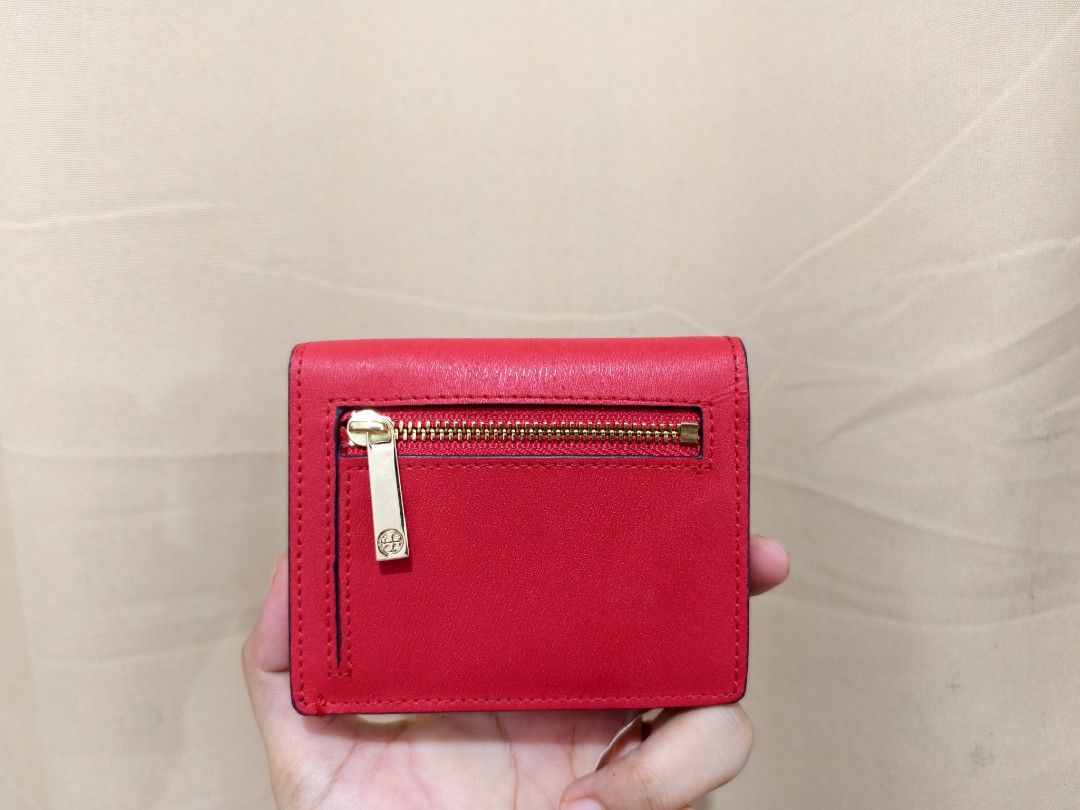 Original Tory Burch Parker Foldable Mini Wallet (Category: Luxury Bags & Wallets) located in Manila. Submitted by findswithalcloset (Listing ID 1433350352, Image 3). Description: -Original Tory Burch Parker Foldable Mini Wallet - Preloved - Rank A condition/excellent - Color: Red exterior, Navy interior - Gold zipper and logo detail - Multiple card slots - Snap closure - Includes style and color tag - Compact and stylish design - Ideal for everyd
