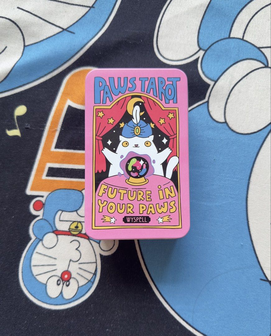 Paws Tarot Deck (Category: Storybooks) located in Taguig. Submitted by seek_and_ship (Listing ID 1433302879, Image 2). Description: - 78-card Paws Tarot Deck - Features major and minor arcana - Adorable cat illustrations - Includes general instructions - Perfect for card readings and manifesting intentions - Have beautiful Blue Honographic Pattern Effect Design - This is so cute and easy to carry anywhere you go.
