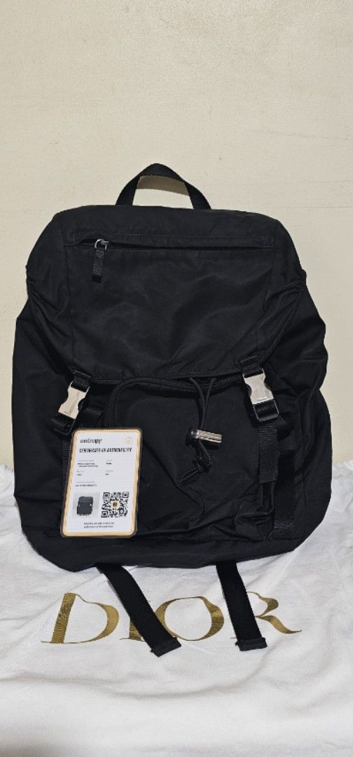 Prada Black Backpack (Category: Luxury Bags & Wallets) located in Cebu City. Submitted by dg_enterprise (Listing ID 1433345279, Image 1). Description: - Authentic Prada backpack - Color: Black - Features Prada buckle and tag - Includes certificate of authenticity - Made in Italy - Drawstring closure - Adjustable straps - Top handle.