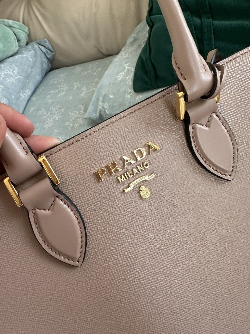 Prada Galleria Saffiano Leather Bag (Category: Luxury Bags & Wallets) located in Cavite. Submitted by bdzblls (Listing ID 1433318146, Image 2). Description: - Authentic Prada handbag - Soft Calf in Cipria similar to Blush Pink - Top handle and detachable shoulder strap - Includes dust bag, authenticity cards, and receipt - Interior zip pocket - Made in Italy - Purchased in Taiwan.
