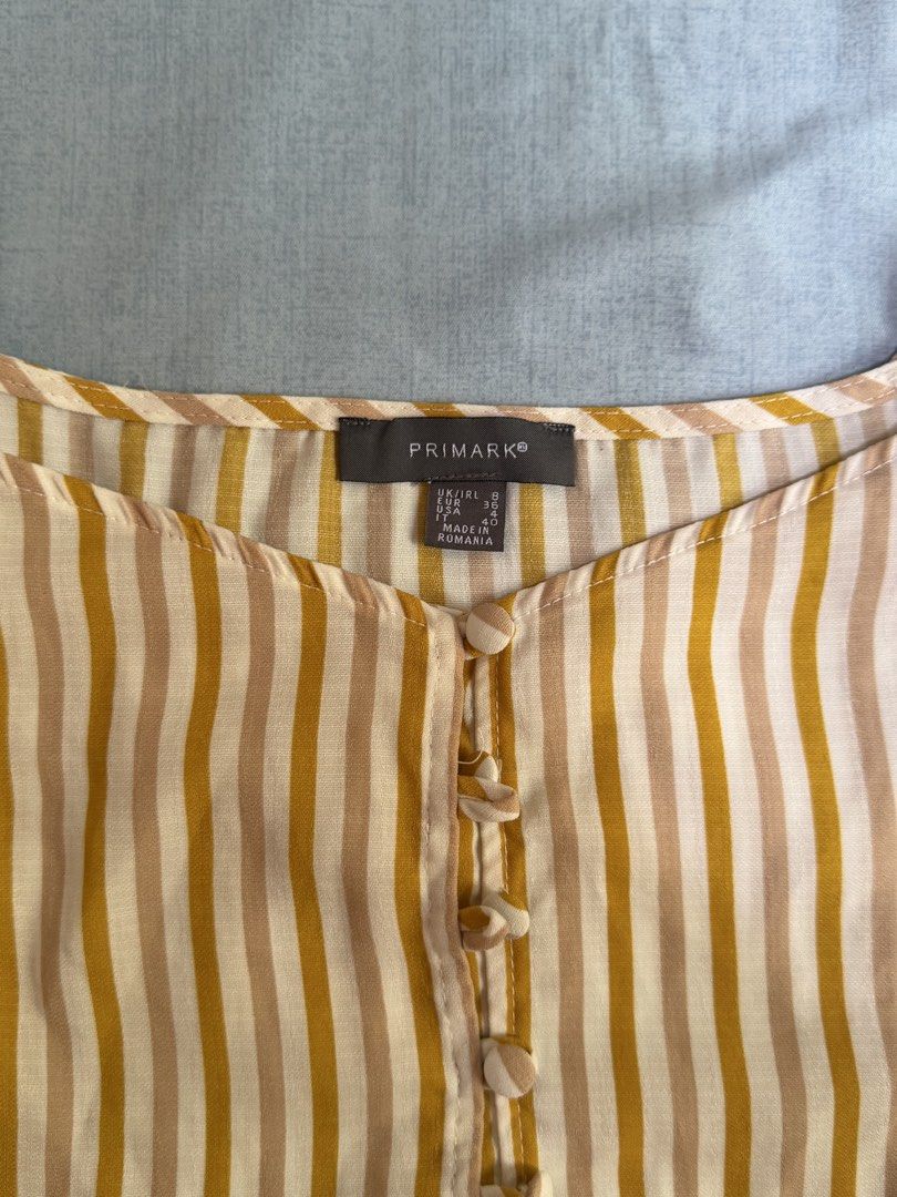Primark Striped Crop Top Yellow (Category: Sleeveless) located in Cebu City. Submitted by hellomolly_ (Listing ID 1433347706, Image 2). Description: - Primark crop top - Yellow and beige striped pattern - Cute top - Size: UK 8 / EUR 36 - high quality top - cebu based - fits small to medium.