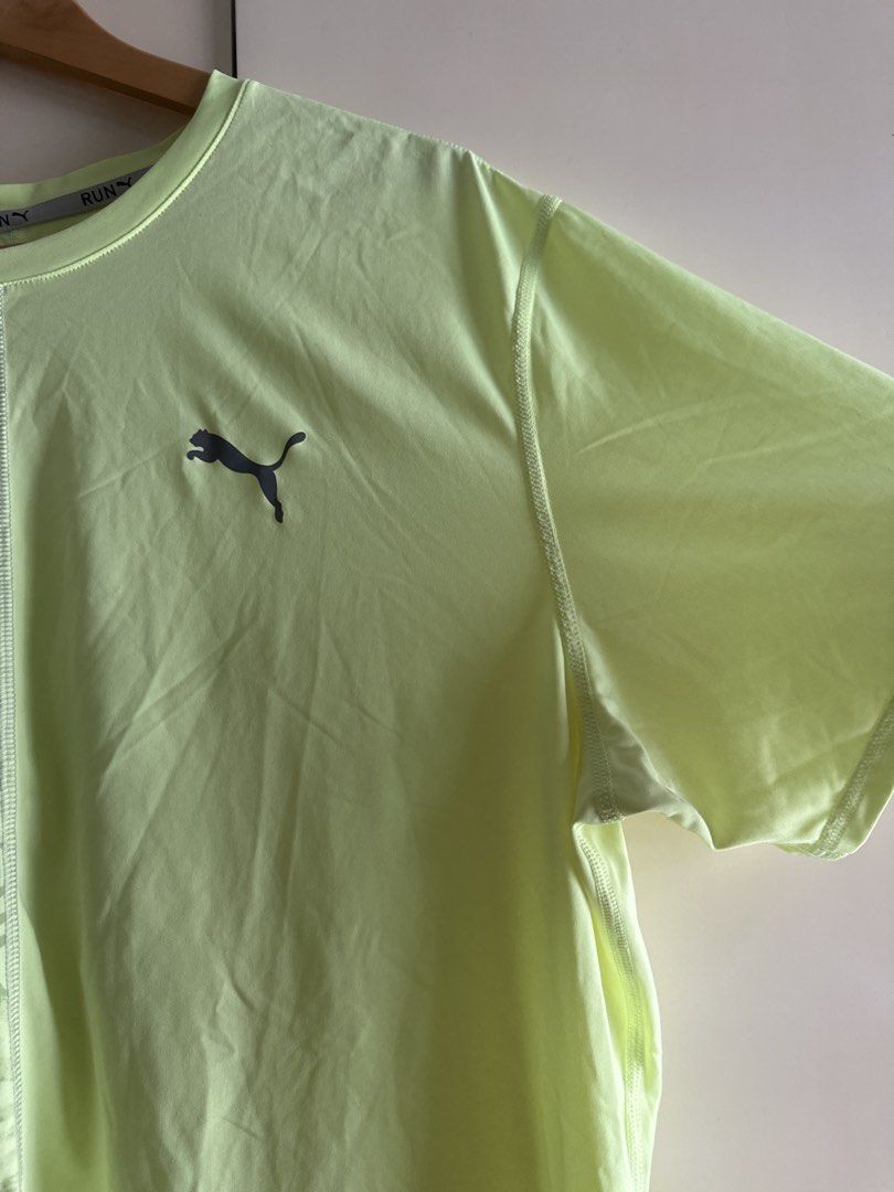 Puma Running T-shirt - XL (Category: Activewear) located in Taguig. Submitted by jsrbrandeditems (Listing ID 1433224359, Image 2). Description: - Puma running t-shirt - Neon green color - Size: XL - Unique split design: patterned left side, solid right side - Features the Puma logo - Crew neck - Short sleeves.
