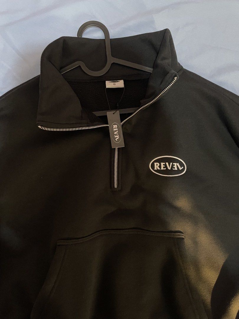 REVEL Black Quarter Zip Sweatshirt (Category: Coats, Jackets and Outerwear) located in Caloocan City. Submitted by dfwdz (Listing ID 1433210159, Image 1). Description: - REVEL black quarter-zip sweatshirt - Features a front pocket - REVEL logo on the chest - High collar - Zipper closure - Includes tag - Size: Not specified.