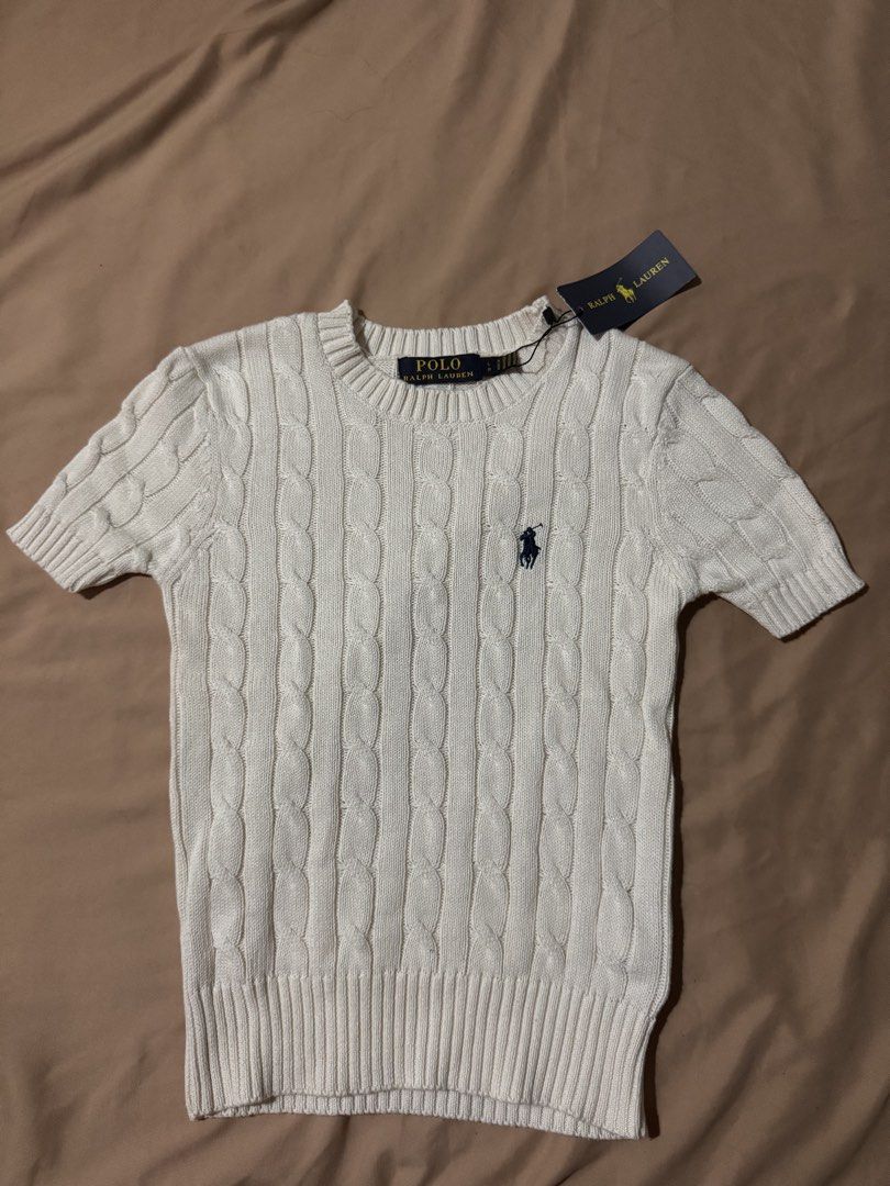 RL Cable Knit (Category: Blouses) located in Dinalupihan. Submitted by declutteredbyaly (Listing ID 1433331507, Image 2). Description: - Crew neck - Short sleeves - Size tag visible - Brand new with original tags.