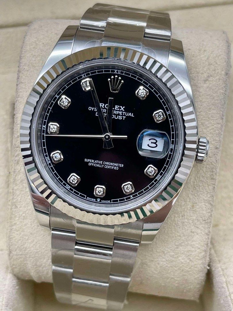 Rolex Oyster Perpetual Datejust Diamond Dial (Category: Luxury Watches) located in Manila. Submitted by watchesbyjamesdy (Listing ID 1433297813, Image 2). Description: - Rolex Oyster Perpetual Datejust - Black diamond dial - Fluted bezel - Stainless steel bracelet - Date window at 3 o'clock - Silver-colored case and bracelet - Features Rolex logo on dial.