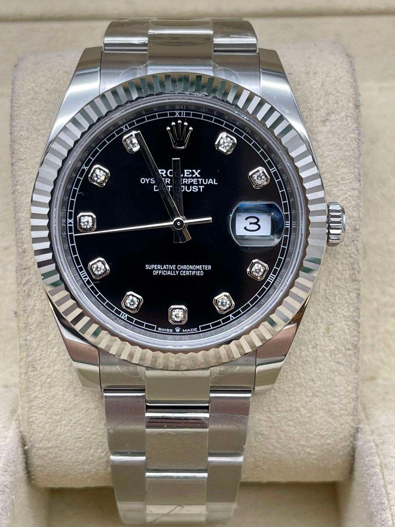 Rolex Oyster Perpetual Datejust Diamond Dial (Category: Luxury Watches) located in Manila. Submitted by watchesbyjamesdy (Listing ID 1433297813, Image 1). Description: - Rolex Oyster Perpetual Datejust - Black diamond dial - Fluted bezel - Stainless steel bracelet - Date window at 3 o'clock - Silver-colored case and bracelet - Features Rolex logo on dial.
