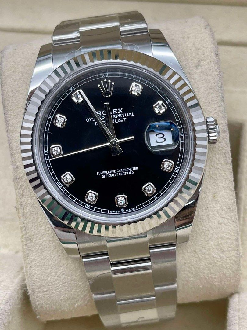 Rolex Oyster Perpetual Datejust Diamond Dial (Category: Luxury Watches) located in Manila. Submitted by watchesbyjamesdy (Listing ID 1433297813, Image 3). Description: - Rolex Oyster Perpetual Datejust - Black diamond dial - Fluted bezel - Stainless steel bracelet - Date window at 3 o'clock - Silver-colored case and bracelet - Features Rolex logo on dial.