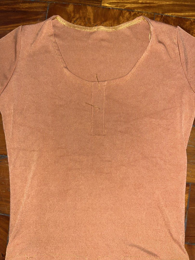 Rust Ribbed Top (Category: Blouses) located in Manila. Submitted by declitterclutter (Listing ID 1433262768, Image 3). Description: - Ribbed, short-sleeved top in muted orange. - Features a flattering scoop neckline and button detail. - No COD - Buyer will shoulder the shipping fee - Decluttering - Some thrifted finds - No to overpricing!! - No to haggling!! - Some loose threads.